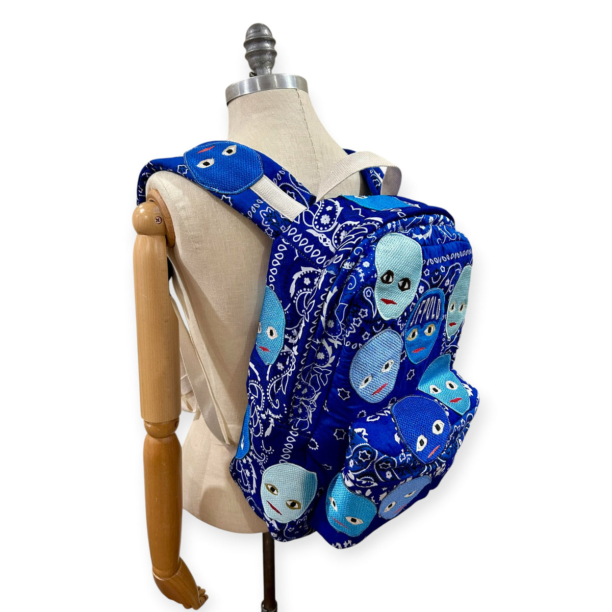 Plastered Faces Backpack Blue Paisley 1/1